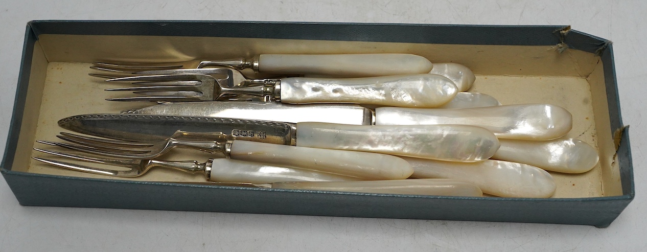 Six pairs of George V mother of pearl handled silver dessert eaters, Frederick C. Asman & Co, Sheffield, 1925, knife 18.9cm. Condition - fair to good